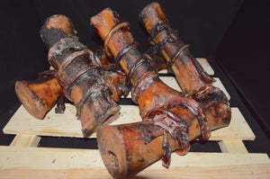 Large beef bones smoked and wrapped with a bully stick. Two treats in one with lots of density and chewability.